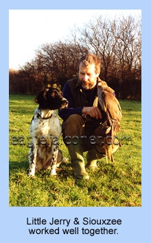 Goshawk, dog and falconer